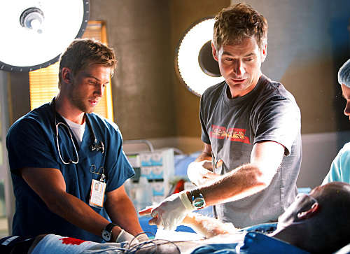 Tuck Brody (Mike Vogel) and Dr. Matthew Proctor (Jeremy Northam) treats a trauma patient on 