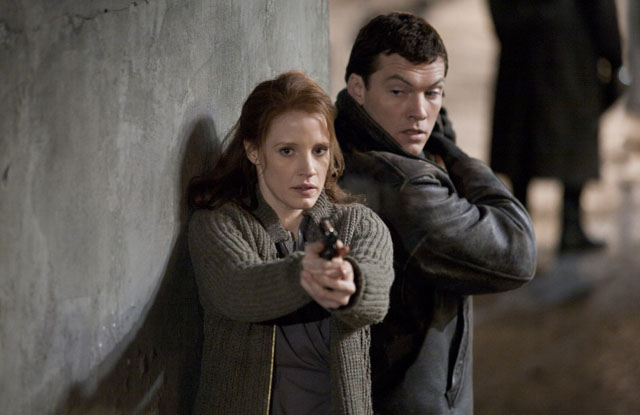 Jessica Chastain as Young Rachel and Sam Worthington as David in ‘The Debt’