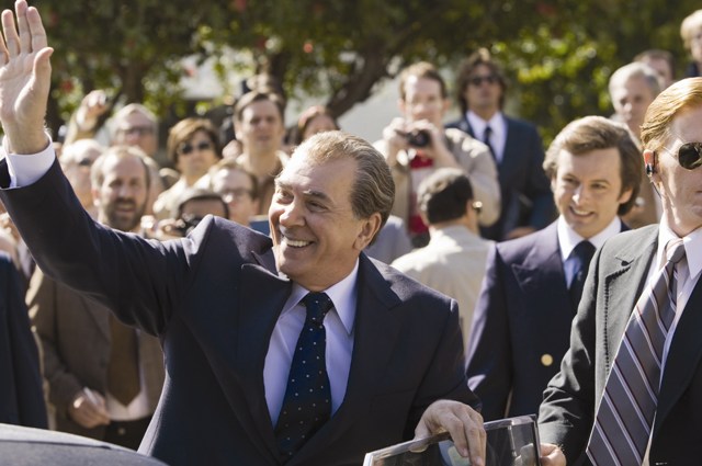 Richard Nixon (Frank Langella) greets an audience while David Frost (Michael Sheen) looks on.