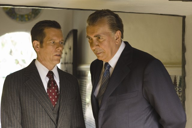 Colonel Jack Brennan (Kevin Bacon) counsels Richard Nixon (Frank Langella) in 