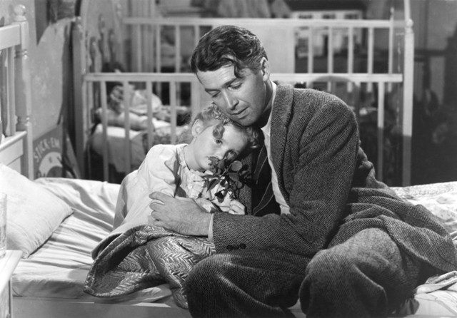 Karolyn Grimes and James Stewart mend petals and hearts in Frank Capra’s It’s a Wonderful Life.