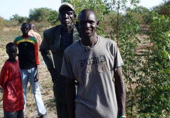 Get Back: Kuek Aleu Garang with His Father at the Site in Wernyol, Sudan Where He was Born in ‘22 Years From Home’