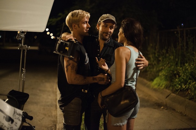 Ryan Gosling, director Derek Cianfrance and Eva Mendes embrace on the set of The Place Beyond the Pines, a Focus Features release.