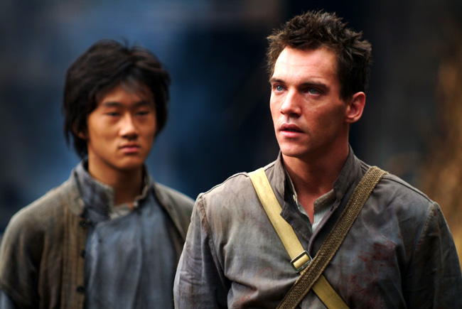 Guang Li (left) as Shi Kai and Jonathan Rhys Meyers (right) as George Hogg in The Children of Huang Shi