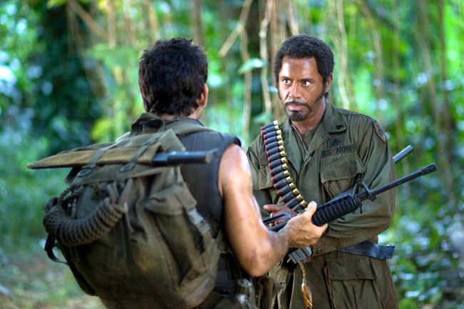 Tugg Speedman (Ben Stiller, left) and Kirk Lazarus (Robert Downey Jr., right) are shooting an epic war movie and wind up in a real battle in the action-comedy Tropic Thunder