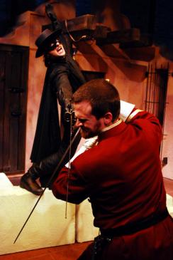 Zorro (James Elly, top) teaches Captain Ramon (Robert Kauzlaric) a bloody lesson in Lifeline Theatre's adaptation of The Mark of Zorro