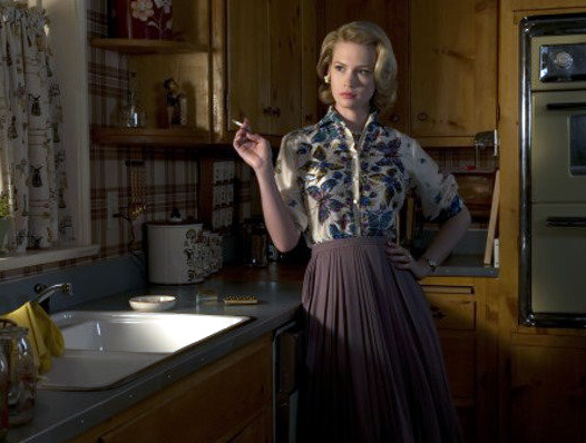 January Jones (left) and Jon Hamm in Mad Men on AMC