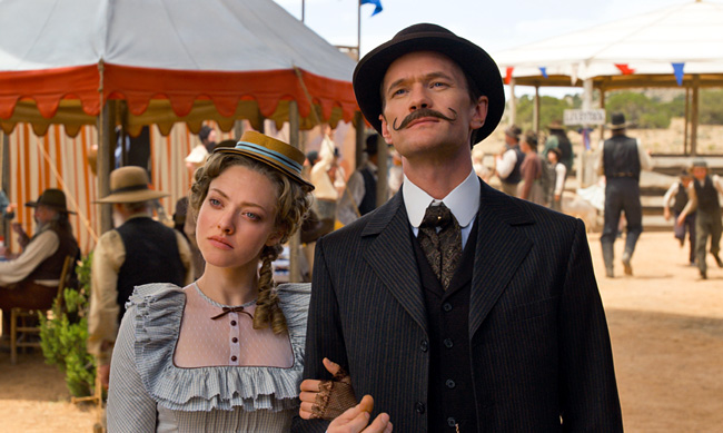 Amanda Seyfried as Louise and Neil Patrick Harris as Foy in A Million Ways to Die in the West