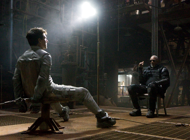 Tom Cruise is grilled by Morgan Freeman in Oblivion