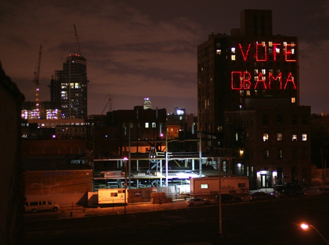 A neon sign proclaiming Obama support glows over Brooklyn in a scene from Jeff Deutchman’s 11/4/08.