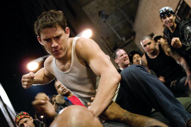 Star brawler Shawn MacArthur (Channing Tatum) faces off with an opponent in the action film Fighting.
