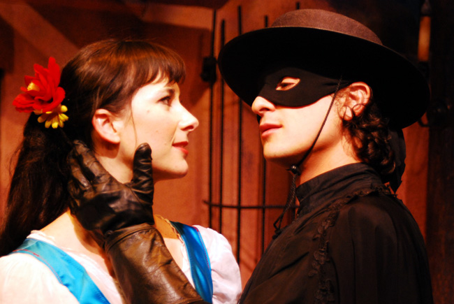 Zorro (James Elly, right) wins the heart of the fiery Lolita (Rosa de Guindos) in Lifeline Theatre's adaptation of The Mark of Zorro by Johnston McCulley, which was adapted by Katie McLean and directed by Dorothy Milne