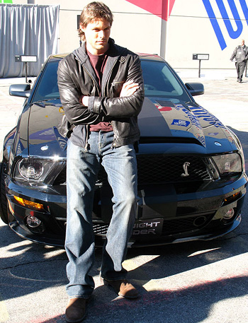 Justin Bruening (pictured here) plays Mike Tracer (Michael Knight’s son) in the new Knight Rider