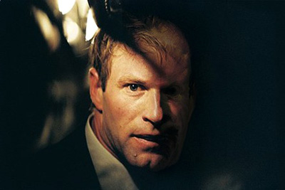 A fan-manipulated version of Aaron Eckhart designed to look like Two-Face in The Dark Knight